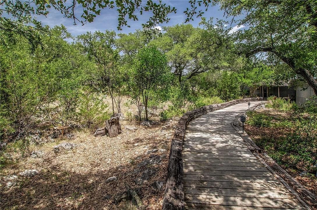 A timber boardwalk crossing the meadow