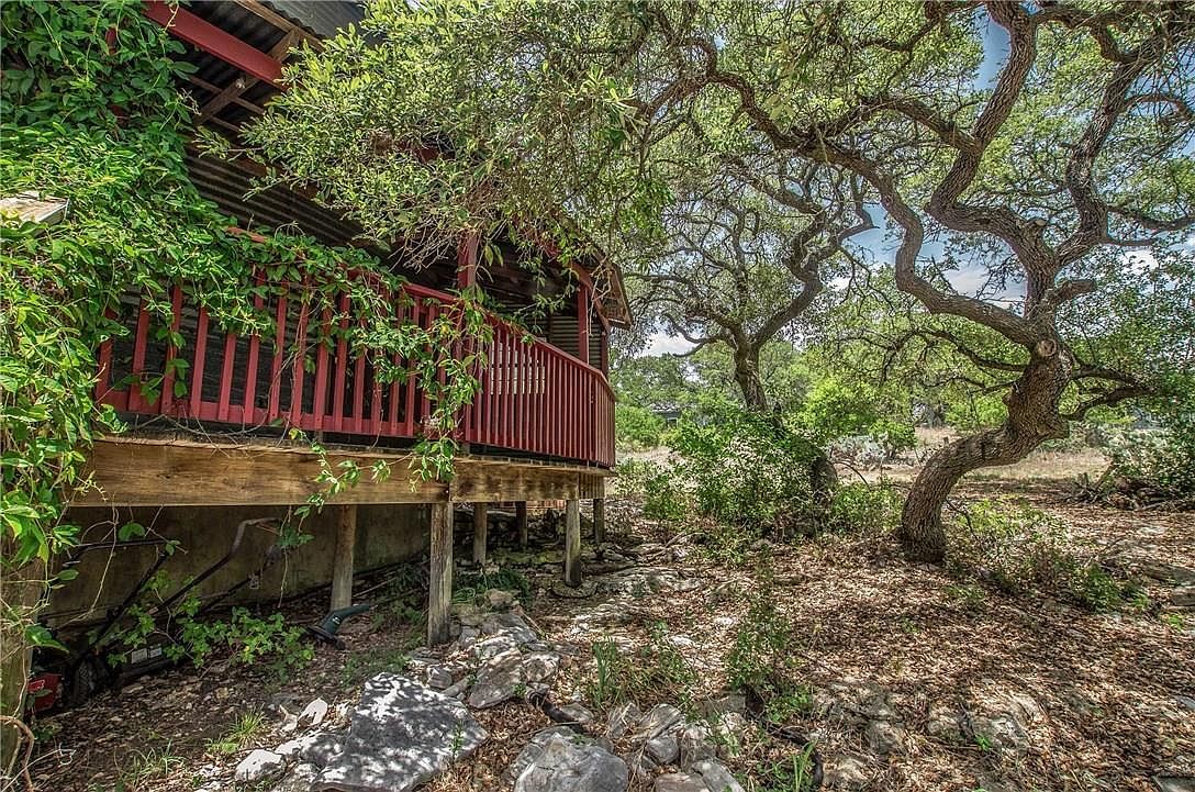 The porch of the silo under live oaks
